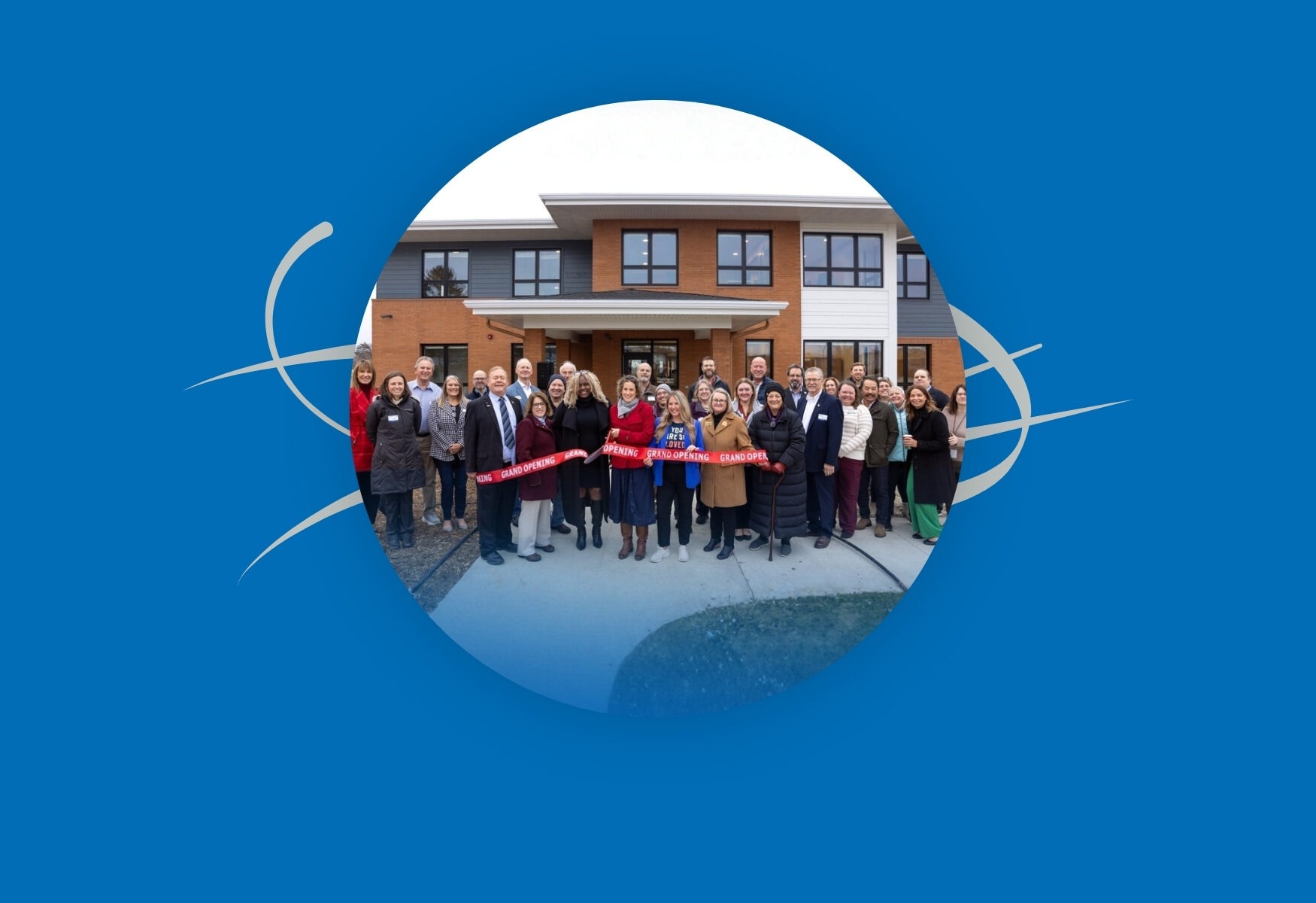 A group of people at a ribbon cutting ceremony